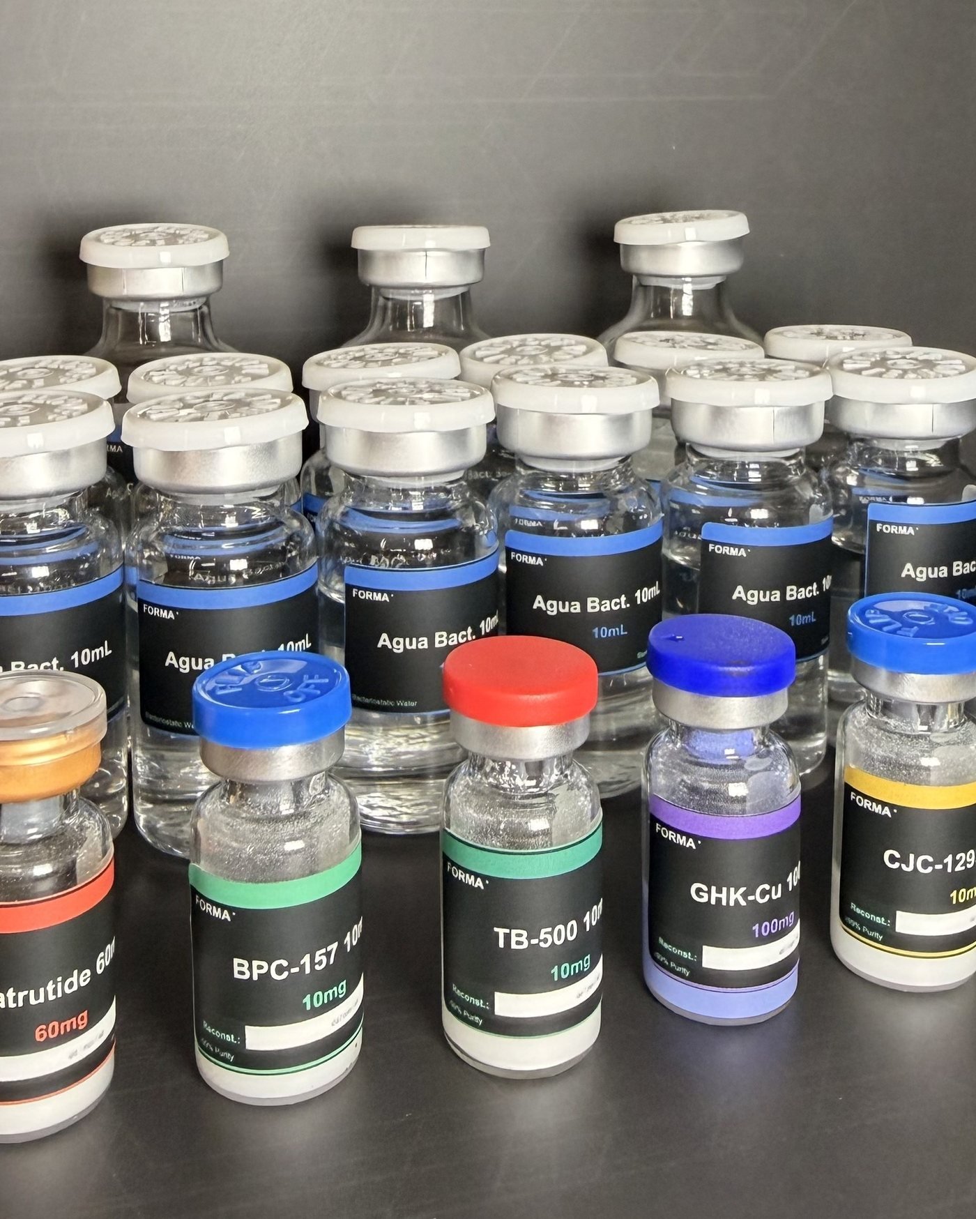Viales de péptidos FORMA°: Retatrutide, BPC-157, TB-500, GHK-Cu, CJC-1295 y agua bacteriostática